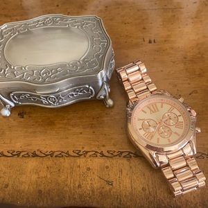 Rose Gold watch with Roman numerals